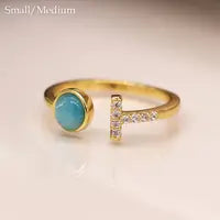 Gold plated open crystal t-bar ring with blue stone