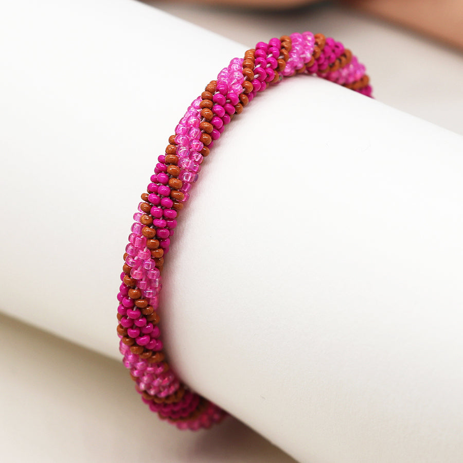 Bright pink and tan twist bead bracelet