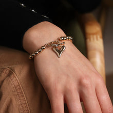 Load image into Gallery viewer, Golden bead and heart charm t-bar bracelet
