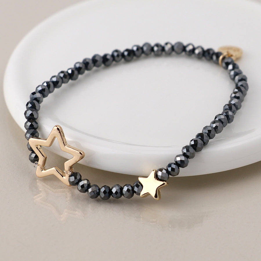 Black bead and golden stars bracelet
