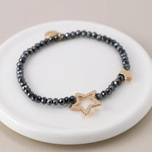 Load image into Gallery viewer, Black bead and golden stars bracelet
