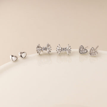 Silver plated bows and hearts triple stud earring set