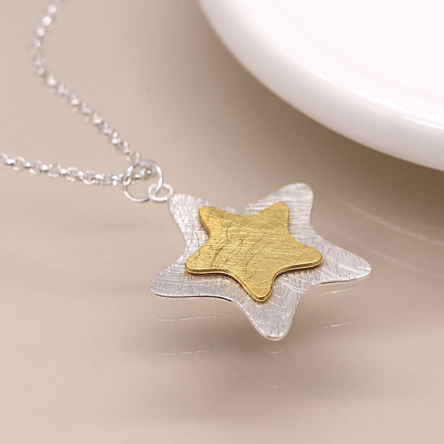 Silver plated and golden layered star necklace