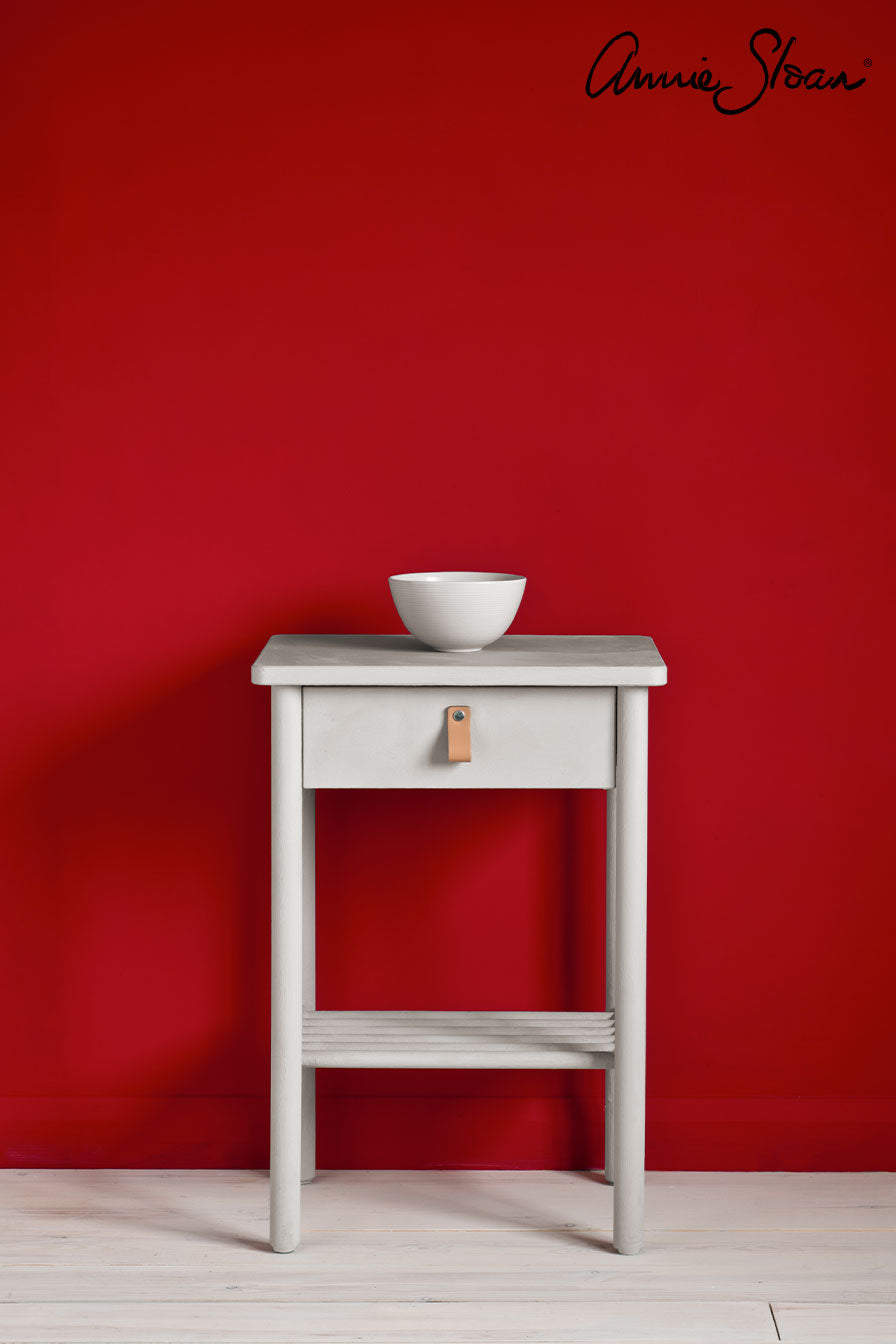 Side table painted with Annie Sloan Chicago Grey Chalk Paint against a wall painted in Emperor Silk Wall Paint
