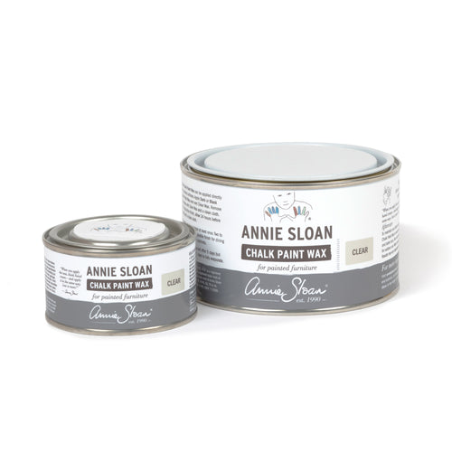 Two tins of Annie Sloan Chalk Paint Wax on a white background