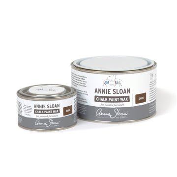 Two tins of Annie Sloan Chalk Paint Wax on a white background