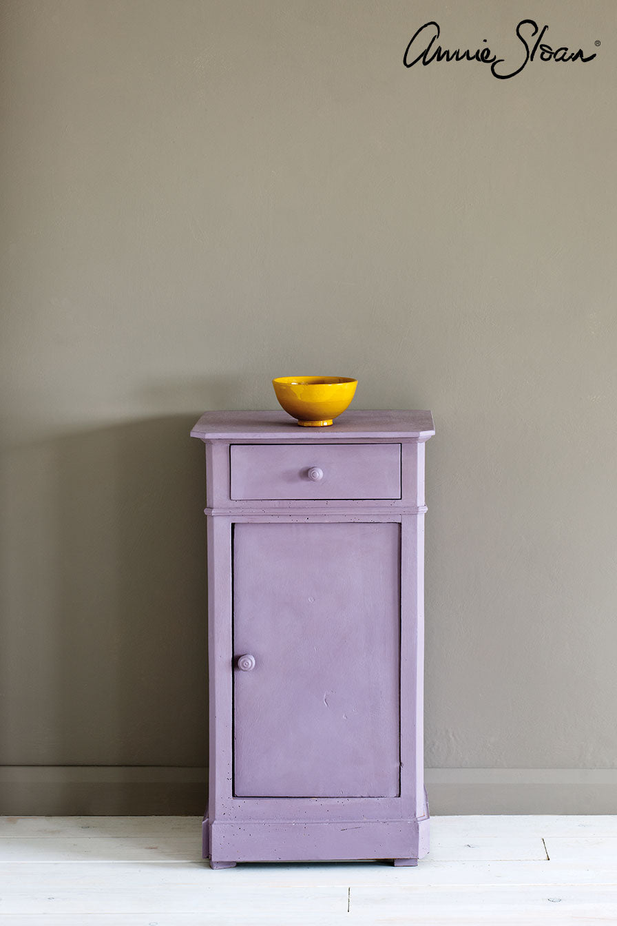 Side table painted in Annie Sloan Emile Chalk paint against a wall painted in French Linen Wall Paint
