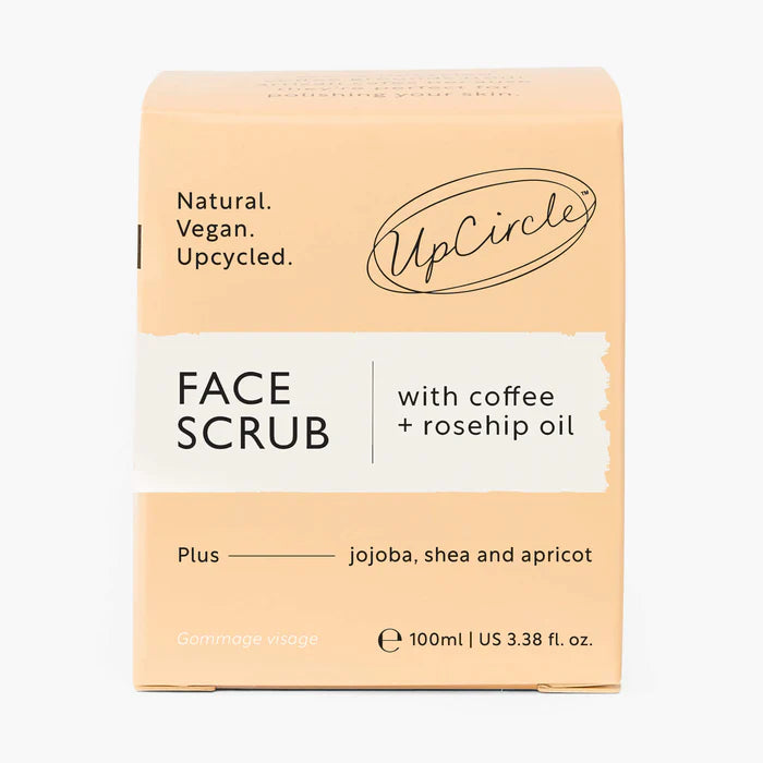 UpCircle Face Scrub packaging with coffee and rosehip oil on a white background