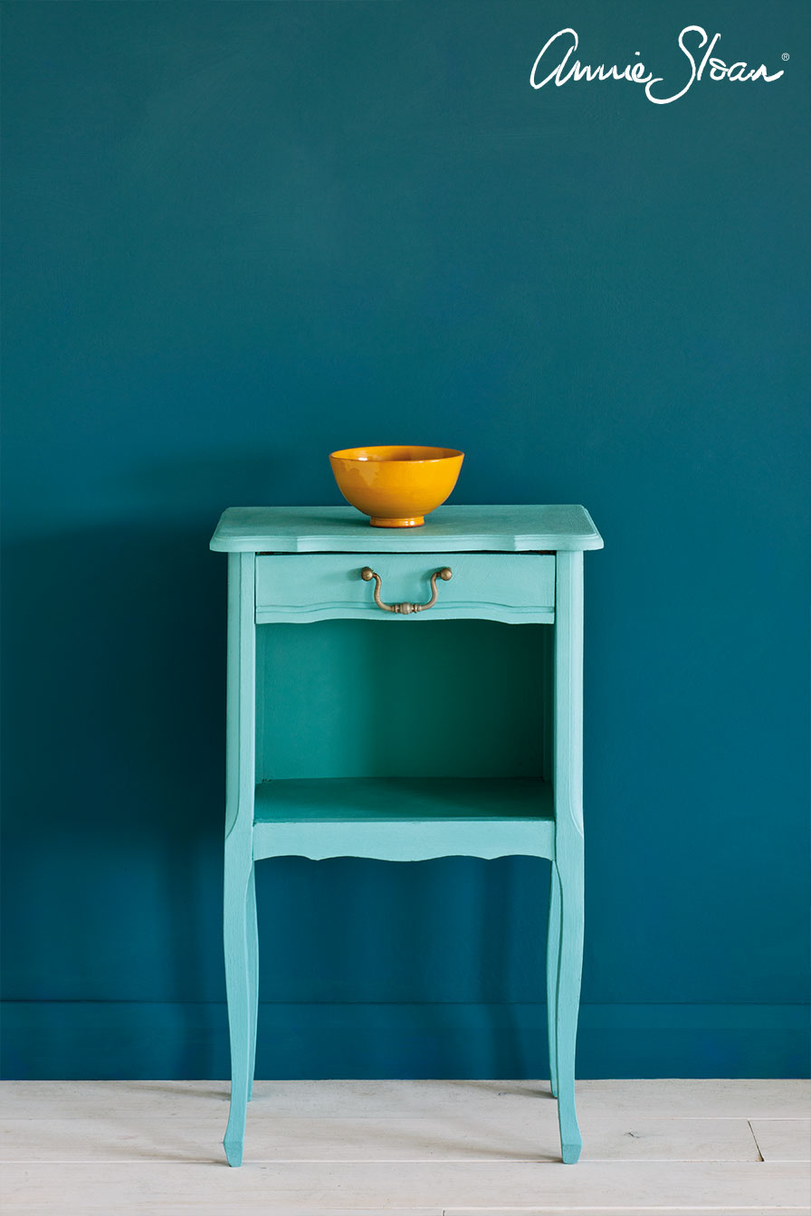 Side table painted in Annie Sloan Provence Chalk Paint against a wall painted with Aubusson wall paint