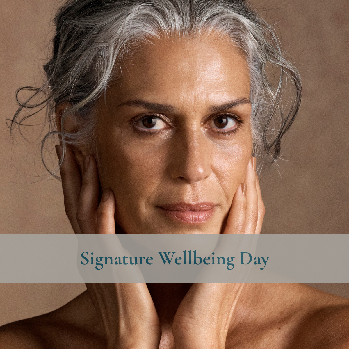 A close-up portrait of a woman with gray hair resting her face on her hands against a warm brown background, with a semi-transparent banner across the lower middle reading 'Signature Wellbeing Day'.