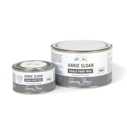 Two tins of Annie Sloan Chalk Paint Wax on a white background
