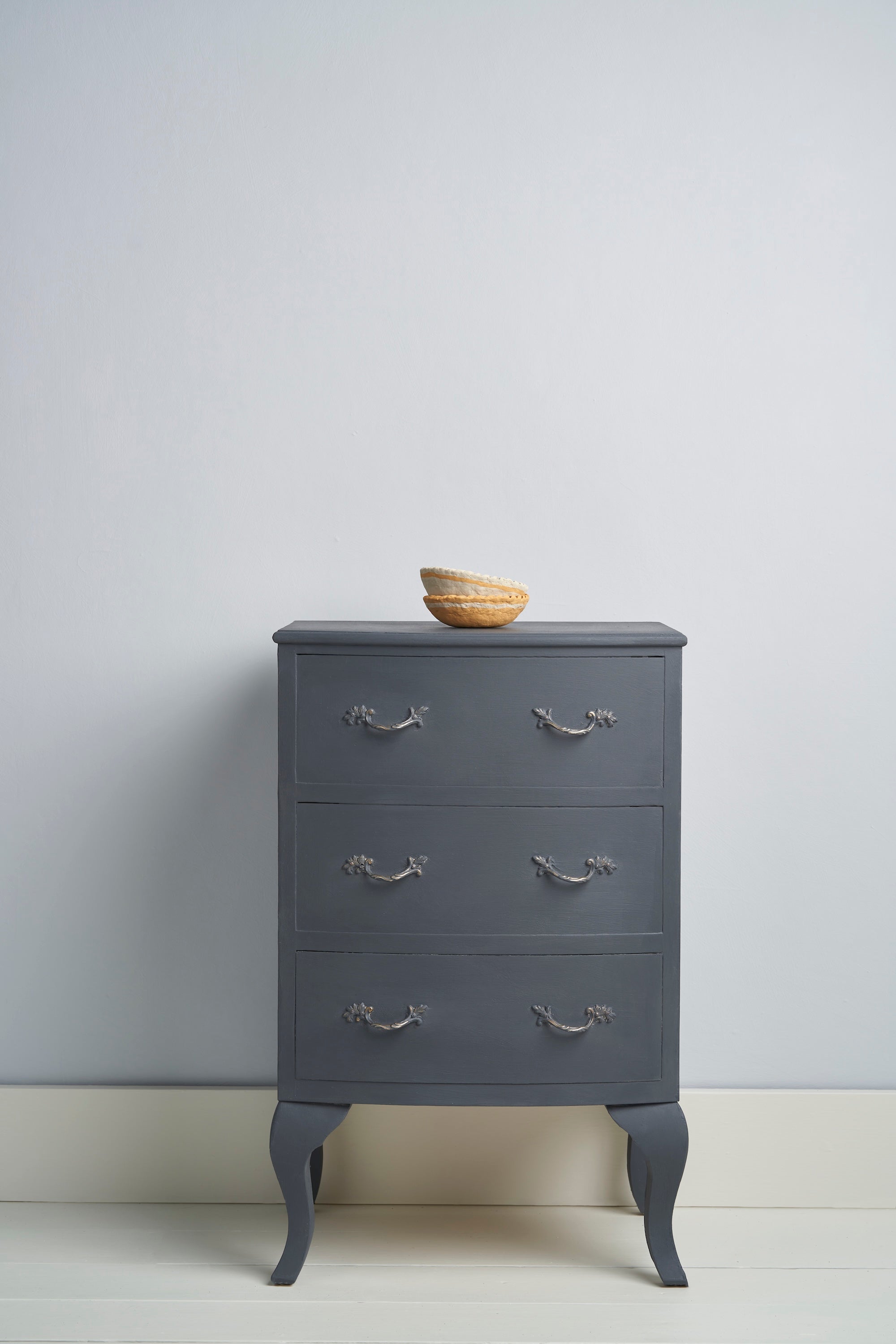 A vintage style chest with silver handles painted with Annie `Sloan Whistler Grey Chalk Paint